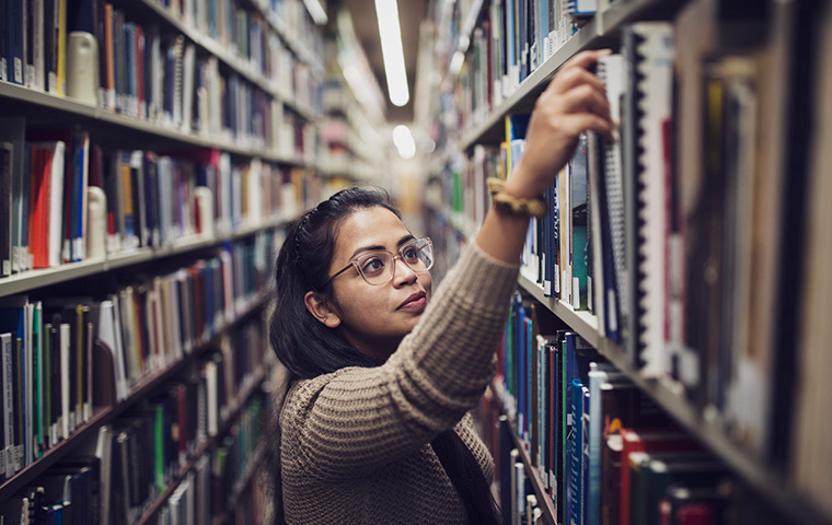 An undergrad student in the library